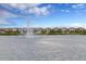 Tranquil lake with fountain and row of houses at 8953 Zurich Ln, Kissimmee, FL 34747