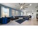 Spacious living room with sectional sofa, coffee table, and large TV at 8953 Zurich Ln, Kissimmee, FL 34747