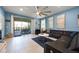 Relaxing living room with comfortable seating and access to the back patio at 8953 Zurich Ln, Kissimmee, FL 34747