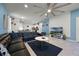 Open living area features a sectional sofa, coffee table, and a large TV at 8953 Zurich Ln, Kissimmee, FL 34747