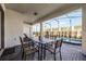 Patio with table and chairs, overlooking the pool area at 8953 Zurich Ln, Kissimmee, FL 34747
