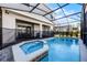 Private pool and spa with covered patio and fenced-in area at 8953 Zurich Ln, Kissimmee, FL 34747