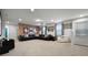 Home theater with brick accent wall and comfortable seating at 8953 Zurich Ln, Kissimmee, FL 34747
