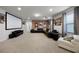Home theater with projector, screen, and comfortable seating at 8953 Zurich Ln, Kissimmee, FL 34747