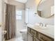 Bathroom with shower/tub combo and vanity at 900 Shorehaven Drive, Poinciana, FL 34759