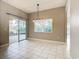 Bright dining room with sliding glass doors leading to an outdoor patio at 900 Shorehaven Drive, Poinciana, FL 34759