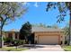 Charming single-story home featuring a two-car garage and well-manicured landscaping and a brick paver driveway at 900 Shorehaven Drive, Poinciana, FL 34759