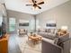 Spacious living room featuring a comfortable sitting area at 900 Shorehaven Drive, Poinciana, FL 34759