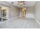 Open living area featuring tile floors, modern lighting, and sliding door to the backyard at 900 Shorehaven Drive, Poinciana, FL 34759