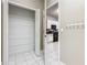 Pantry with white shelving located off of the kitchen with ample space for storage at 900 Shorehaven Drive, Poinciana, FL 34759