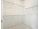 Bright walk-in closet with white walls and wire shelving at 900 Shorehaven Drive, Poinciana, FL 34759