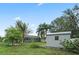 Spacious backyard with a shed, screened in pool, and lush landscaping at 918 San Paulo Way, Kissimmee, FL 34758