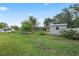 Large backyard with shed, lush landscaping, and room for gardening at 918 San Paulo Way, Kissimmee, FL 34758