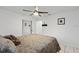 Bedroom featuring a ceiling fan, white walls, tile flooring, and a closet at 918 San Paulo Way, Kissimmee, FL 34758