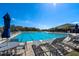 Inviting community pool area with ample seating, perfect for relaxation and socializing at 918 San Paulo Way, Kissimmee, FL 34758