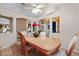Traditional dining room featuring a light wood table, china cabinet, and arched doorways at 918 San Paulo Way, Kissimmee, FL 34758