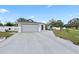 Two-car garage with a gray door and a white frame at 918 San Paulo Way, Kissimmee, FL 34758