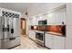 Modern kitchen showcasing stainless steel appliances and bright white cabinetry at 918 San Paulo Way, Kissimmee, FL 34758
