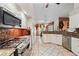 Bright kitchen featuring granite counters, stainless steel appliances, and tile flooring at 918 San Paulo Way, Kissimmee, FL 34758