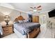 The main bedroom features a large bed and decorative furniture at 918 San Paulo Way, Kissimmee, FL 34758