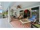 Outdoor patio with furniture, ceiling fans, and access to the interior at 918 San Paulo Way, Kissimmee, FL 34758