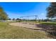 Community playground featuring swings, a covered picnic pavilion, and fenced perimeter at 918 San Paulo Way, Kissimmee, FL 34758