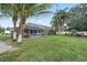 Beautiful backyard with a screened-in pool and well-maintained landscaping at 918 San Paulo Way, Kissimmee, FL 34758
