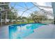 Large screened-in pool with clear blue water and ample space for lounging at 918 San Paulo Way, Kissimmee, FL 34758