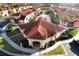 Aerial view of community with clubhouse and pool at 1068 Lake Berkley Dr, Kissimmee, FL 34746