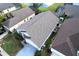 Aerial view showcasing home's roof and landscaping at 1068 Lake Berkley Dr, Kissimmee, FL 34746