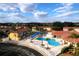 Aerial view of community pool and surrounding buildings at 1068 Lake Berkley Dr, Kissimmee, FL 34746