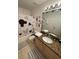 Mickey Mouse themed bathroom with shower/tub combo at 1068 Lake Berkley Dr, Kissimmee, FL 34746