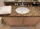 Bathroom vanity with granite countertop and sink at 1068 Lake Berkley Dr, Kissimmee, FL 34746
