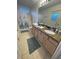 Bathroom with double vanity, granite countertop, and shower/tub combo at 1068 Lake Berkley Dr, Kissimmee, FL 34746