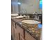 Bathroom with double vanity and granite countertop at 1068 Lake Berkley Dr, Kissimmee, FL 34746
