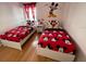 bedroom with twin beds and Mickey Mouse theme at 1068 Lake Berkley Dr, Kissimmee, FL 34746