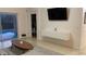 Gathering room with pool view, TV, and built-in media console at 1068 Lake Berkley Dr, Kissimmee, FL 34746