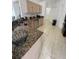 This kitchen features granite countertops and ample cabinet space at 1068 Lake Berkley Dr, Kissimmee, FL 34746