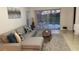 Spacious living room with sectional sofa and pool view at 1068 Lake Berkley Dr, Kissimmee, FL 34746