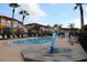 Community swimming pool with lounge chairs at 1068 Lake Berkley Dr, Kissimmee, FL 34746