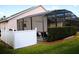 Screened in pool area with white fence at 1068 Lake Berkley Dr, Kissimmee, FL 34746