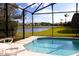 Relaxing screened pool with lake view at 1068 Lake Berkley Dr, Kissimmee, FL 34746
