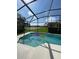 Screened pool with lake view and floating tubes at 1068 Lake Berkley Dr, Kissimmee, FL 34746