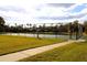 Community tennis court with fence at 1068 Lake Berkley Dr, Kissimmee, FL 34746