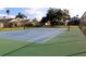 Community tennis court with green surface at 1068 Lake Berkley Dr, Kissimmee, FL 34746