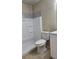 Bathroom with white vanity, tiled shower, and updated fixtures at 1075 S Hiawassee Rd # 912, Orlando, FL 32835