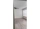 Bright bedroom with wood-look flooring and ceiling fan at 1075 S Hiawassee Rd # 912, Orlando, FL 32835