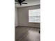 Spacious bedroom with wood-look flooring and ceiling fan at 1075 S Hiawassee Rd # 912, Orlando, FL 32835