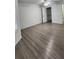 Spacious bedroom with wood-look flooring and large closet at 1075 S Hiawassee Rd # 912, Orlando, FL 32835