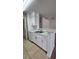 White kitchen features a breakfast bar and modern finishes at 1075 S Hiawassee Rd # 912, Orlando, FL 32835